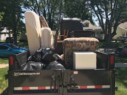 Fully loaded truck with mattresses and furniture during a junk removal service in Troutman